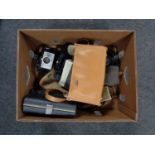 A box of vintage cameras and camera bags