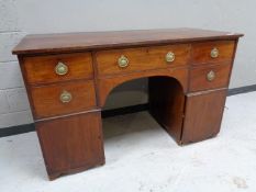 An early nineteenth century mahogany pedestal sideboard