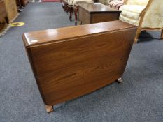 An Ercol elm drop coffee table