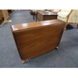 An Ercol elm drop coffee table