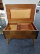 A mid century teak Arnold sewing table