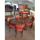 An inlaid mahogany flap sided pedestal table and six stained beech chairs