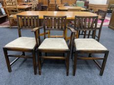 A set of six Ercol stained elm dining chairs