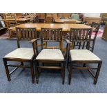 A set of six Ercol stained elm dining chairs