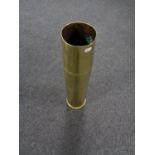 A large brass ammunition shell casing