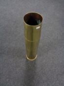 A large brass ammunition shell casing