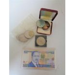 A bag of British crowns, £5 coin, foreign coins, J F K medal,