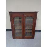 A Victorian glazed double door bookcase