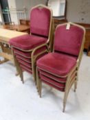 A set of ten metal framed stacking banqueting chairs