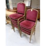 A set of ten metal framed stacking banqueting chairs