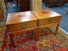 A pair of mahogany lamp tables fitted a drawer