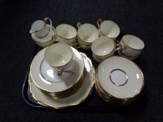 A tray of thirty-nine pieces of Wedgwood gilt rimmed tea china