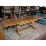 An early twentieth century oak pull out table on bulbous legs