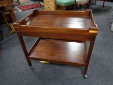 A mahogany butler's tray on two tier trolley