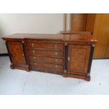 A reproduction mahogany inverted breakfronted sideboard