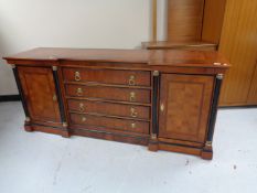 A reproduction mahogany inverted breakfronted sideboard