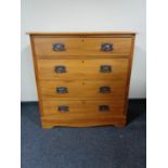 An Edwardian pine four drawer chest