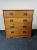 An Edwardian pine four drawer chest