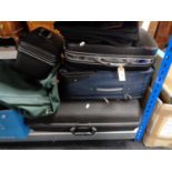 Three luggage cases, a vanity case, holdall,