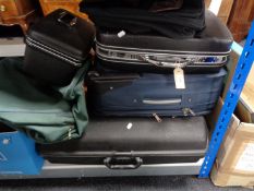 Three luggage cases, a vanity case, holdall,