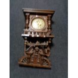 An early twentieth century continental wall clock with brass and enamelled dial (af)