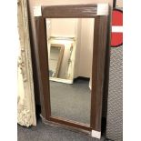 A brown contemporary flat framed mirror