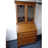 A George III oak bureau bookcase