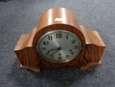 A 1930's walnut cased Halller clock with enamel dial