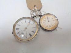A silver cased pocket watch together with a silver cased fob watch by Langdon Davies and Company