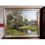 A gilt framed oil on canvas signed L.