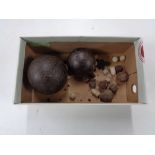 A box of antique cannon balls and shots