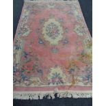 A pink embossed Chinese carpet,