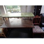 An onyx effect coffee table on metal base and an oak refectory table