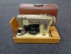 A cased Alfa electric sewing machine CONDITION REPORT: This item has not been