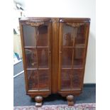 A 1930's oak double door display cabinet