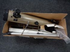 A boxed Tasco telescope with stand