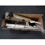 A boxed Tasco telescope with stand