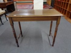 An Edwardian mahogany side table