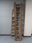 A set of folding wooden ladders together with a wooden triple section extension ladder