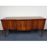 An inlaid mahogany Regency style serpentine fronted sideboard