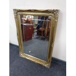 An ornate gilt framed mirror