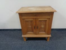 A continental oak double door cabinet