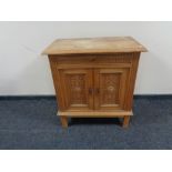 A continental oak double door cabinet