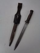 A WW II German bayonet in scabbard with leather holster
