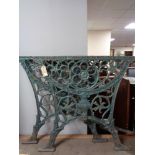 A pair of cast iron table ends 68.5 cm width x 65 cm height.