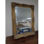 A Victorian style gilt framed overmantel mirror