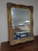 A Victorian style gilt framed overmantel mirror