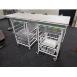 Two medical trolleys fitted with trays and baskets