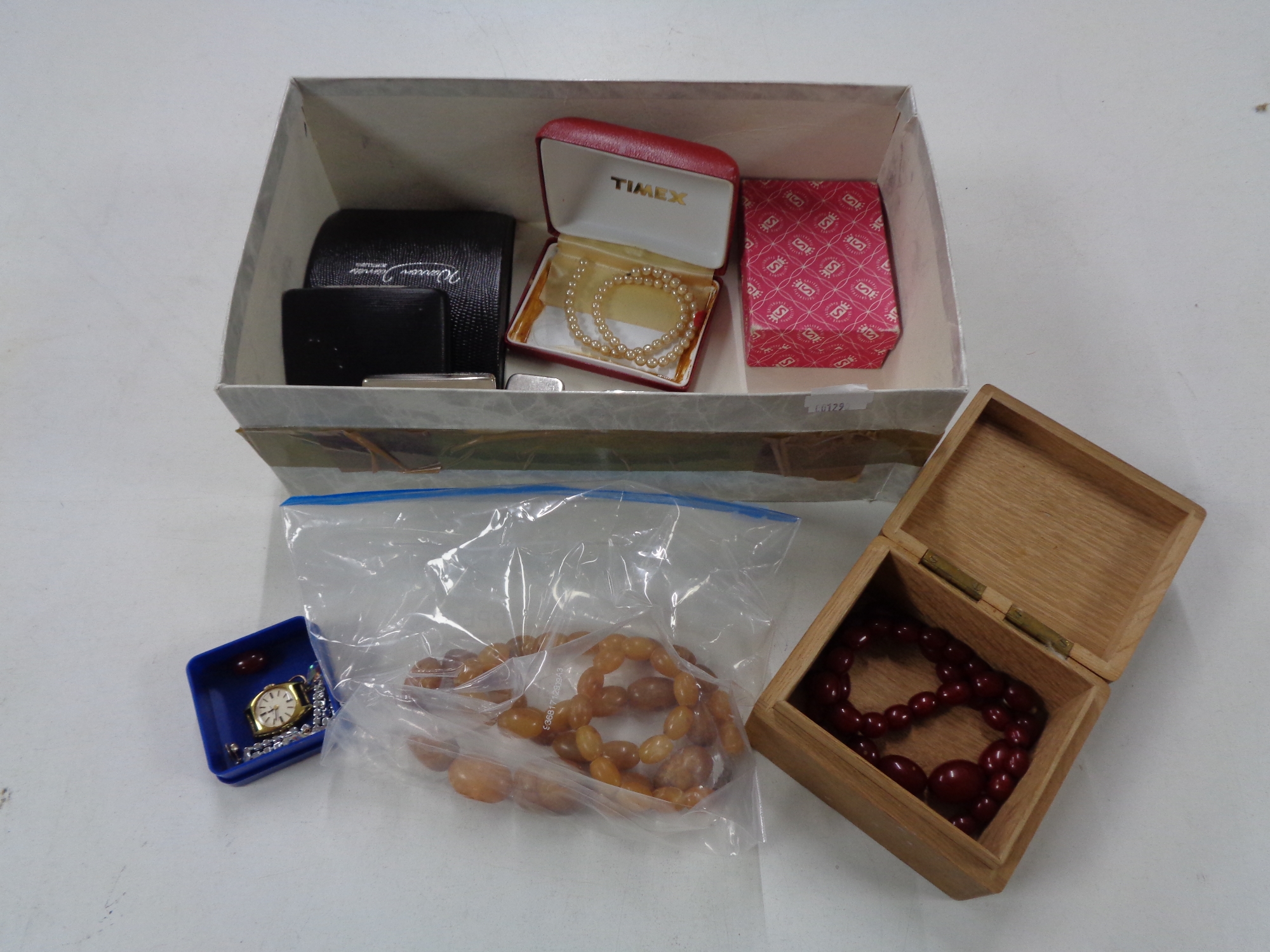 A box of costume jewellery, necklaces,