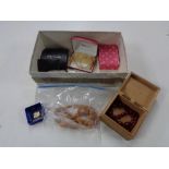 A box of costume jewellery, necklaces,